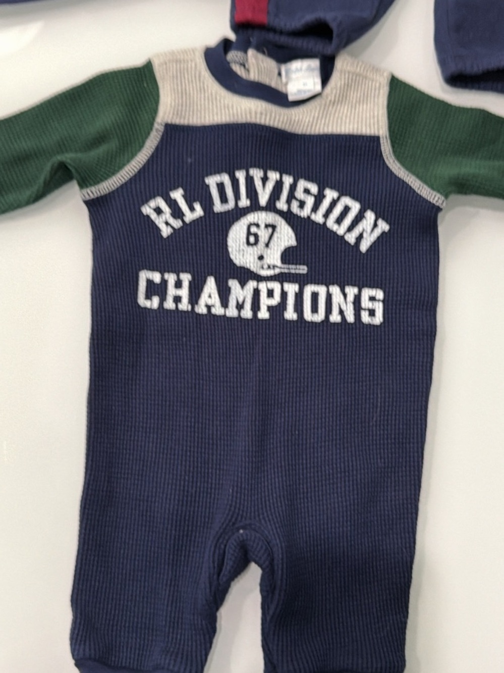 Ralph Lauren navy one-piece with green sleeves and cream yoke